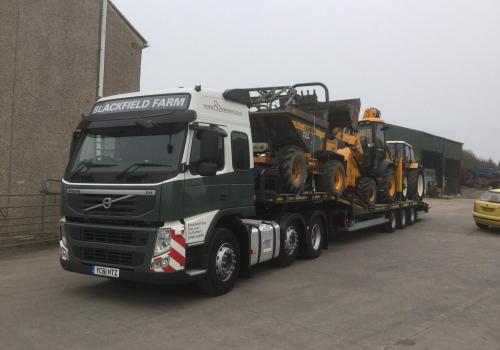 Load of construction equipment heading out to a job in Glasgow for local groundworks contractor